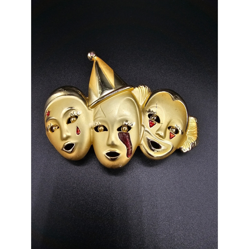 Gold-tone Three Mask Brooch with Red Accent